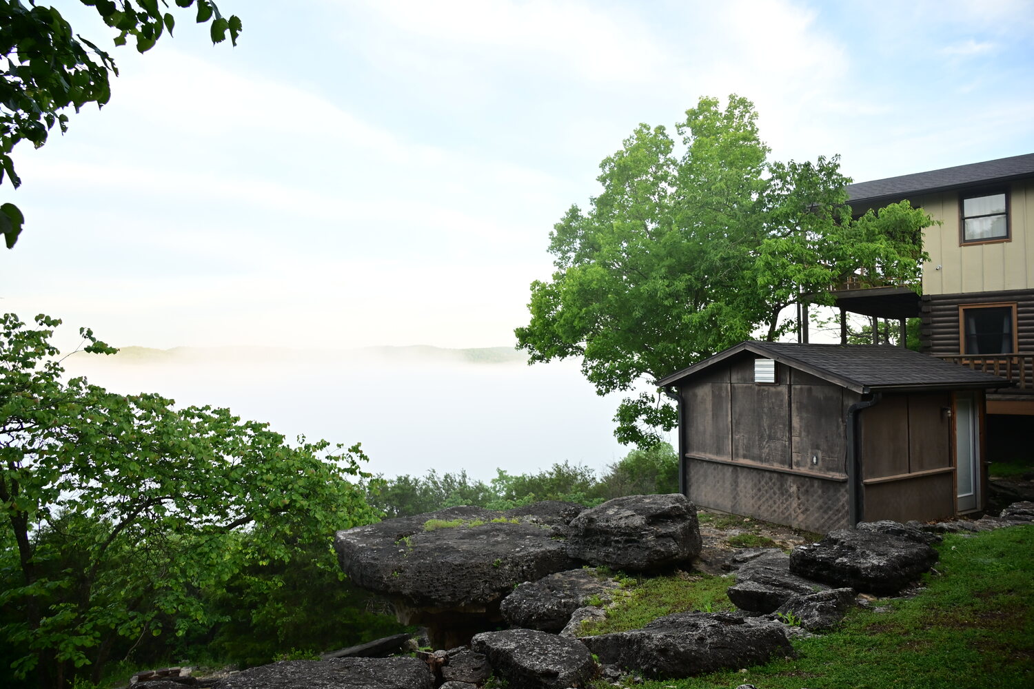 Log cabin and deck overlooking the wooded White River valley